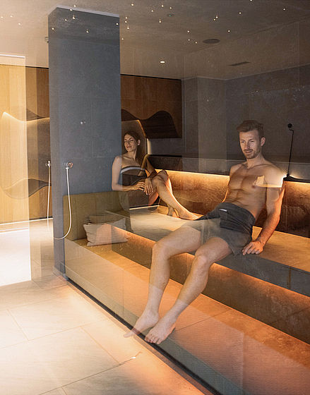 Couple enjoy sauna in the sauna area